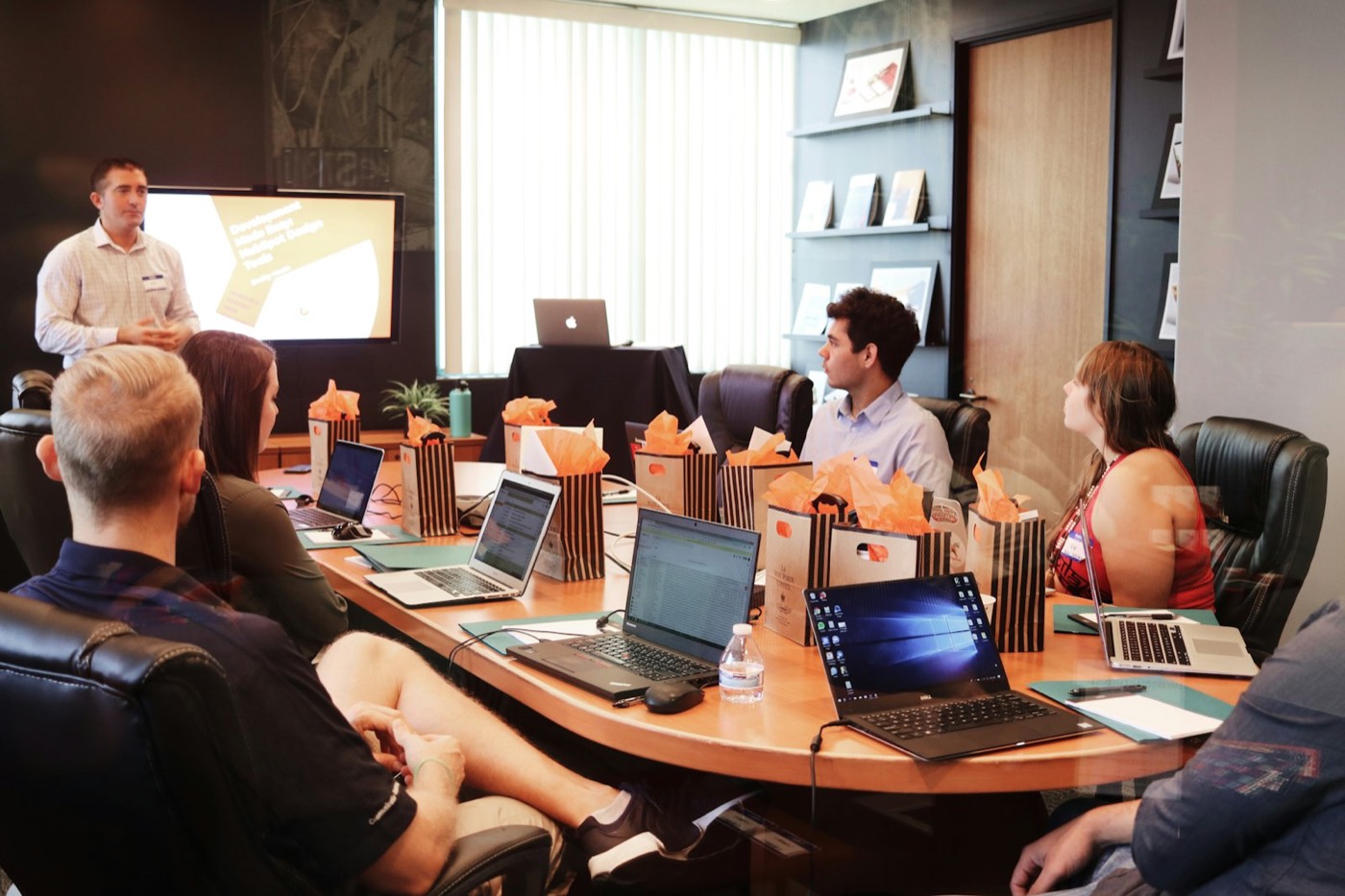 A manager leading a people management training session for a small team